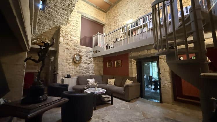 Mezzanine library overlooking the living room at Hauts de Sauliès
